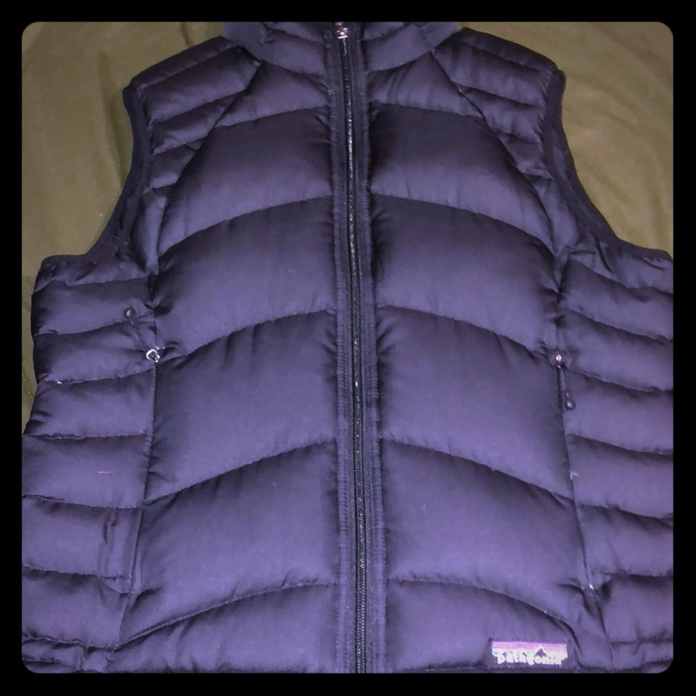 Black puffy Patagonia vest.
